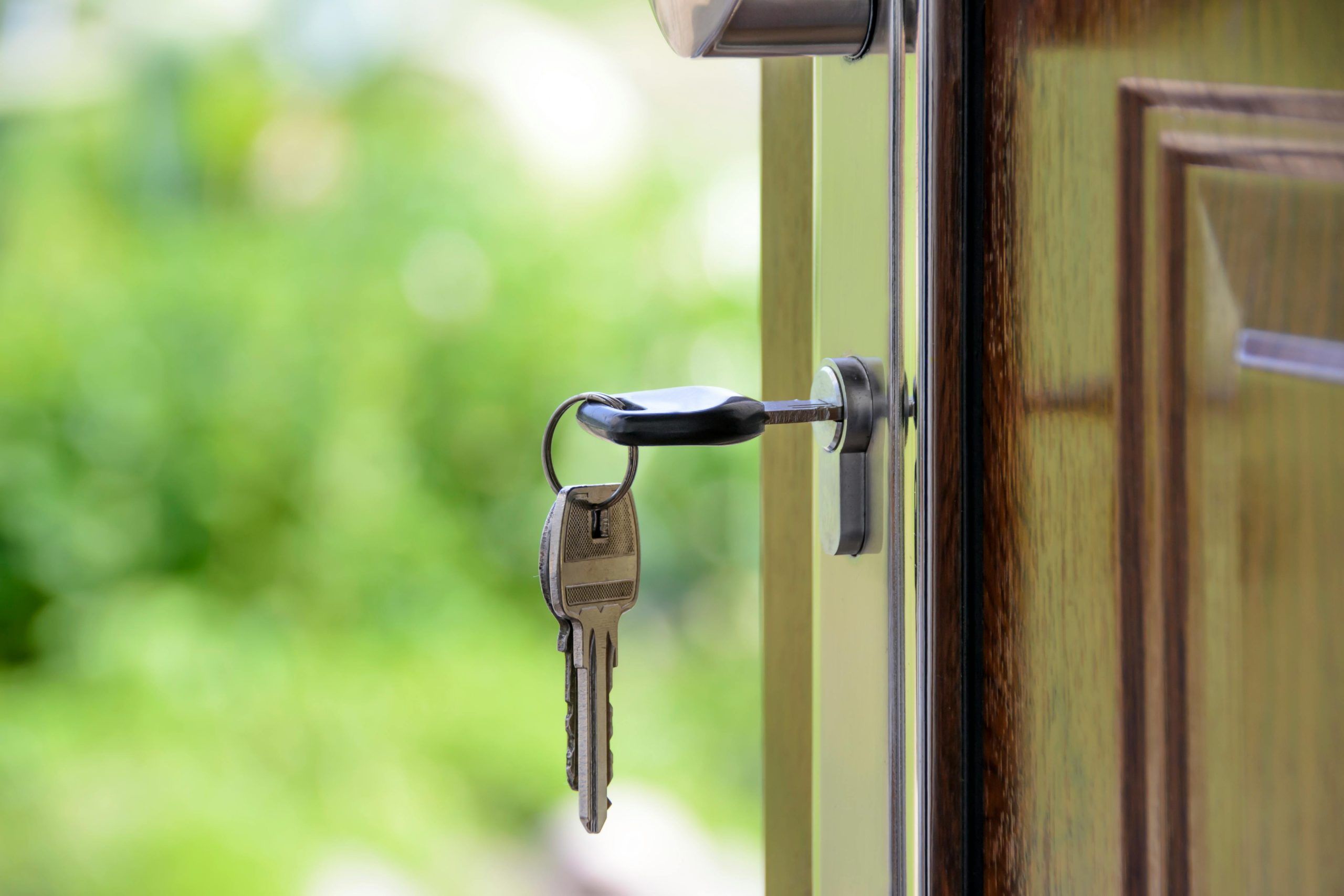 keys in front door of house just purchased